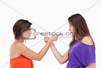 Teenagers pointing fingers on each other