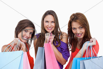 Teenage girls proudly coming back from shopping