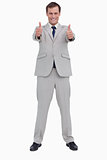 Smiling businessman giving thumbs up