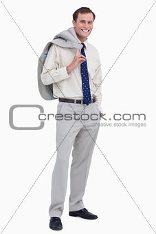 Smiling businessman with jacket over his shoulder