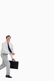 Running businessman with his suitcase