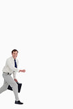 Businessman running with his suitcase