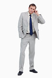 Businessman listening to caller on his mobile phone