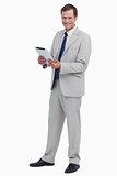 Smiling businessman with his tablet computer