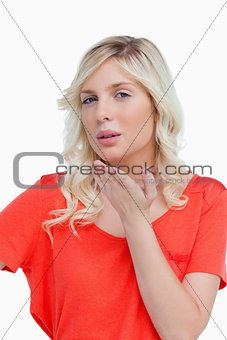 Beautiful young blonde woman sending a kiss