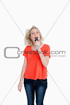 Dynamic teenager singiing karaoke
