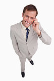 Close up of smiling businessman scratching his head