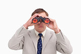 Businessman using binoculars