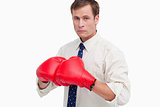 Businessman with boxing gloves ready to fight