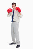 Businessman with his boxing gloves ready to fight
