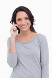 Close up of smiling woman on her cellphone