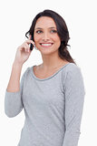 Close up of smiling woman on her mobile phone