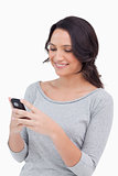 Close up of smiling woman reading text message