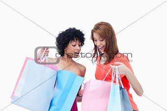 Teenagers showing their purchases to each other