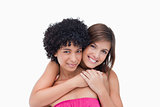 Happy teenage girls hugging each other
