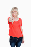 Serious blonde woman pointing her finger