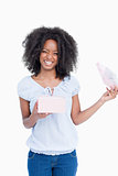 Happy young woman opening a present