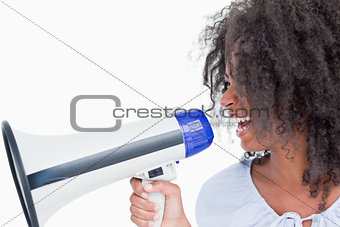 Young woman talking into a megaphone