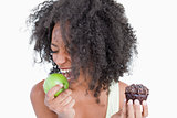 Young woman going to eat a delicious green apple