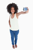 Young smiling woman holding her digital camera
