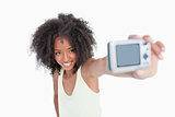 Smiling young woman photographing herself