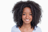 Young woman with curly hairstyle showing a great smile
