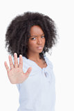 Young angry woman making the hand stop sign