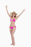 Blonde teenager raising her arms while standing upright