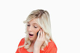 Young woman energetically speaking with a mobile phone