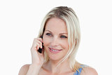 Smiling blonde woman using her cellphone