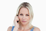 Blonde woman looking at the camera while calling