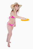 Dynamic and attractive teenager playing frisbee