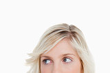 Upper part of a blonde woman face looking on the side