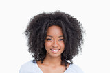 Young woman with curly hair standing upright
