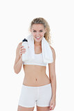Young smiling woman standing with a towel around her neck