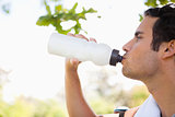 Man drinking from a sports bottle