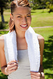 Smiling woman holding a towel