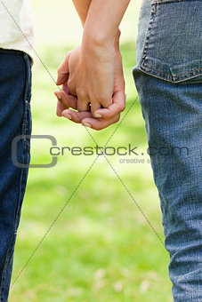 Two friends holding hands