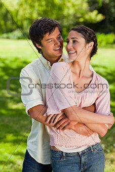 Man looking at his friend while he is holding her