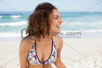 Young attractive woman looking on the side while standing on the