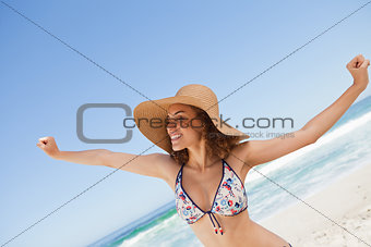 Young woman showing her happiness while opening her arms