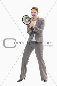 Businesswoman talking on a megaphone