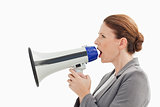 Businesswoman talking into megaphone