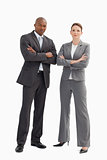 Business man and woman with hands crossed
