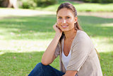 Relaxed woman sitting on the lawn