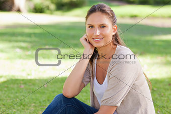 Relaxed woman sitting on the lawn