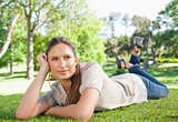 Relaxed woman lying on the grass