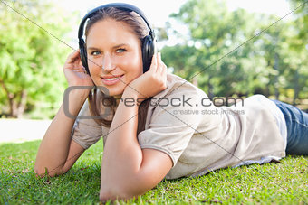 Woman listening to music on the lawn