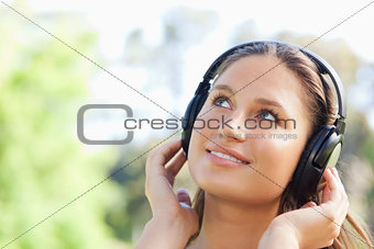 Woman listening to music in the park