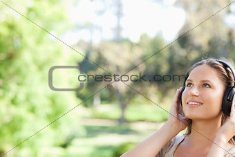 Woman in the park listening to music